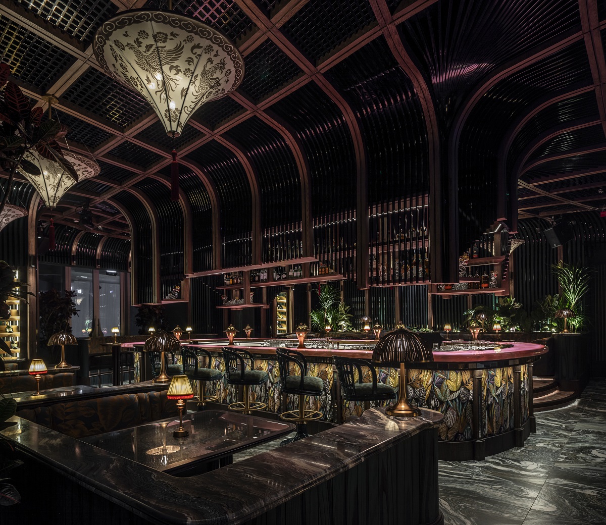black and gold surfaces, marble floor and phoenix rising motif in TATTU Dubai bar