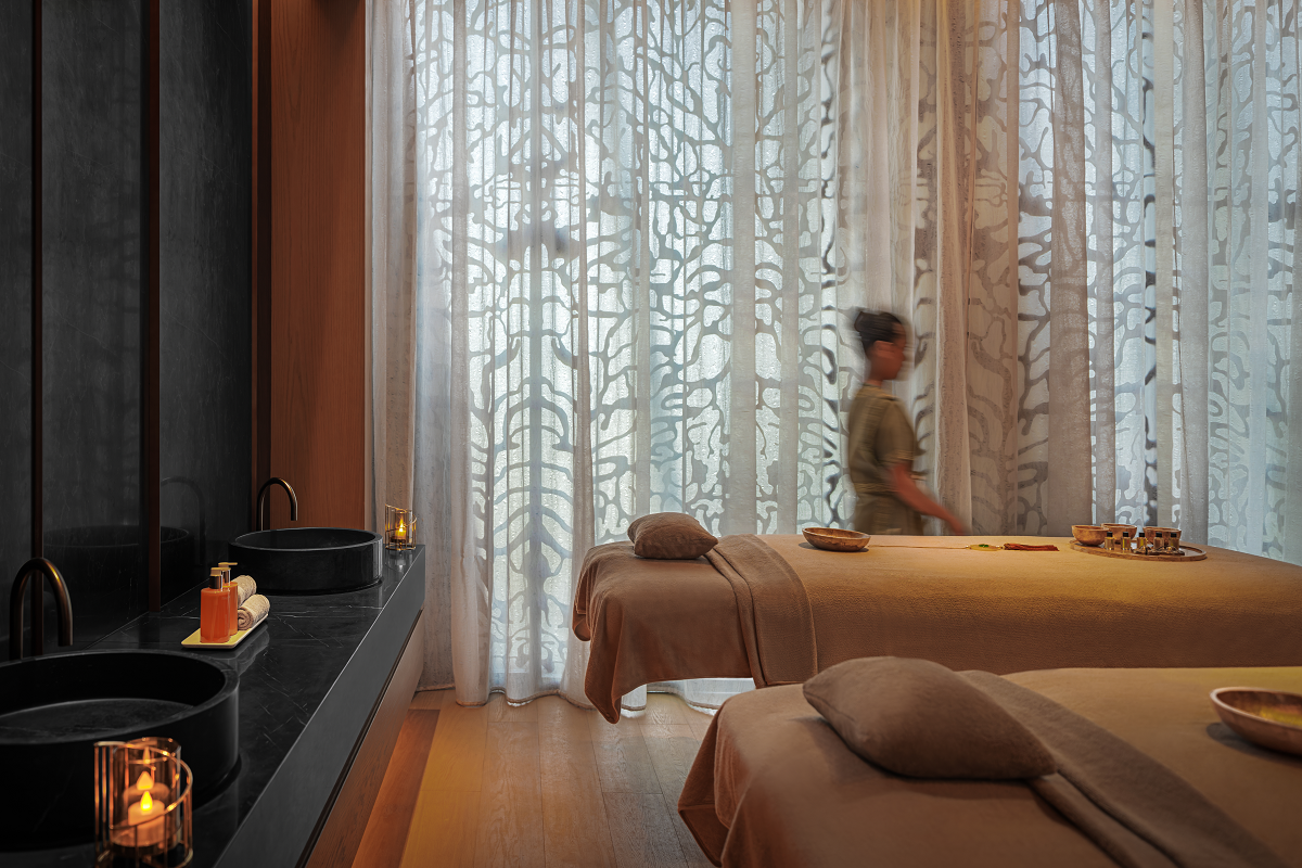 therapy beds, candles and sheer curtains in Mandarin Oriental Spa