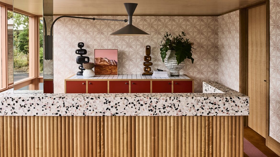 wood panel and terrazzo reception desk at Hotel Flinders with design by Studio Tate