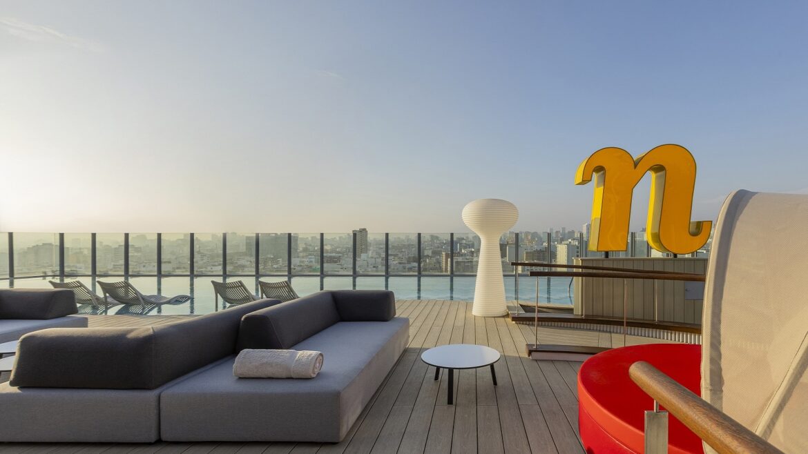 roof top view and terrace with pool and signage at nhow_Lima