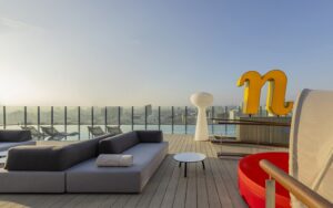 roof top view and terrace with pool and signage at nhow_Lima