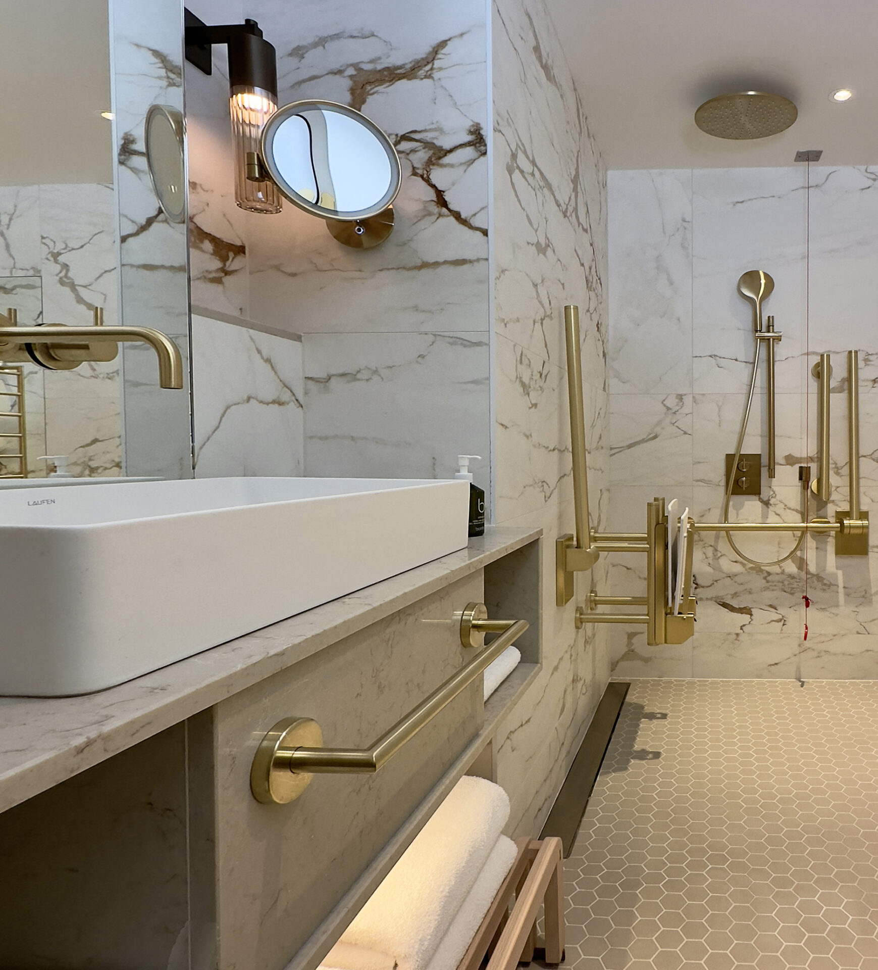 White marble and brass fixture bathroom at Montcalm Mayfair, by Fitzroy of London x Studio Mica
