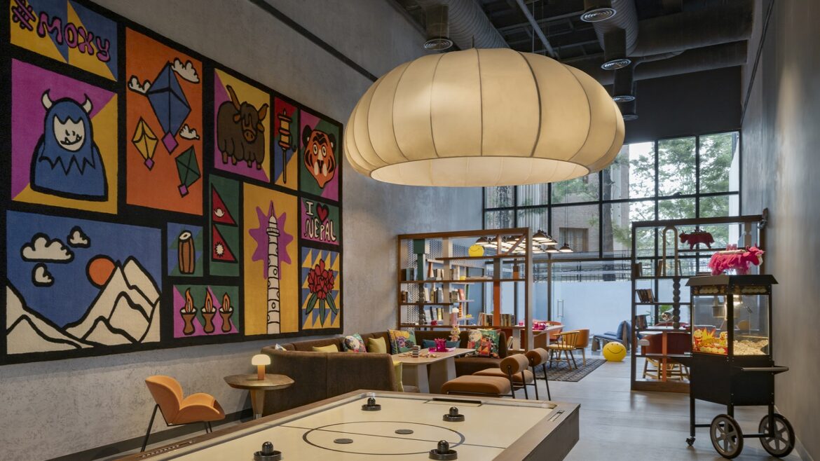 oversized light and colourful paintings in the play zone of Moxy Kathmandu