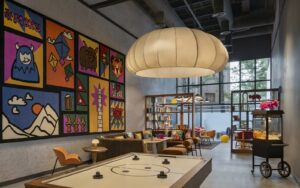 oversized light and colourful paintings in the play zone of Moxy Kathmandu