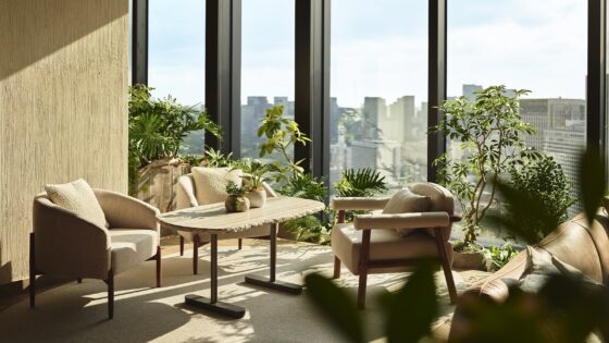 lounge area in1 Hotel Tokyo with floor to ceiling windows with views over trees and city