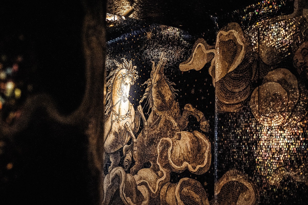 moody corridor with mosaic mural