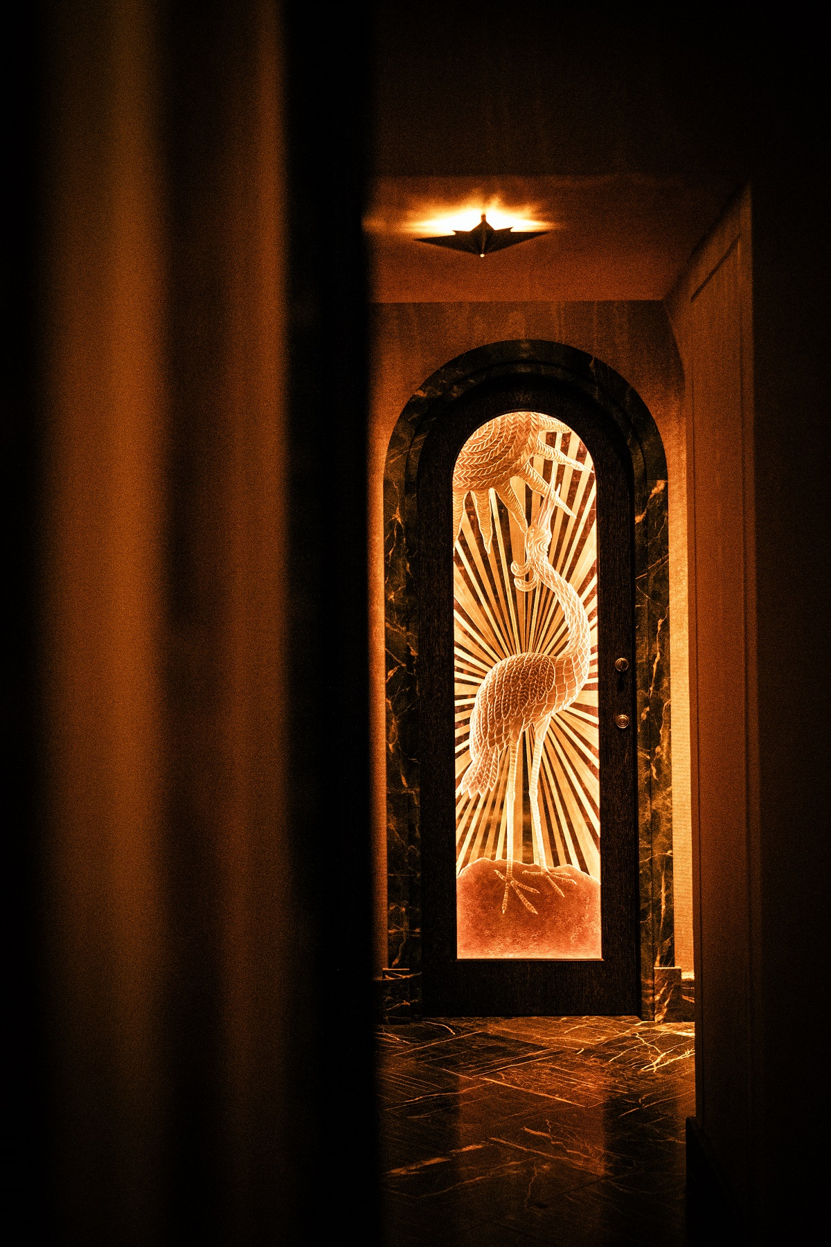 corridor with mural and lighting in L'Aventure