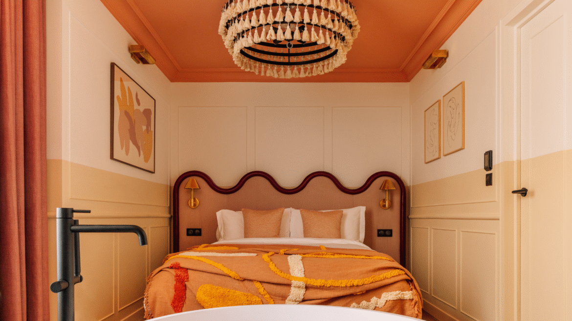 Luxury hotel bedroom at Locke hotel Paris with tufted chandelier by Northern Lights