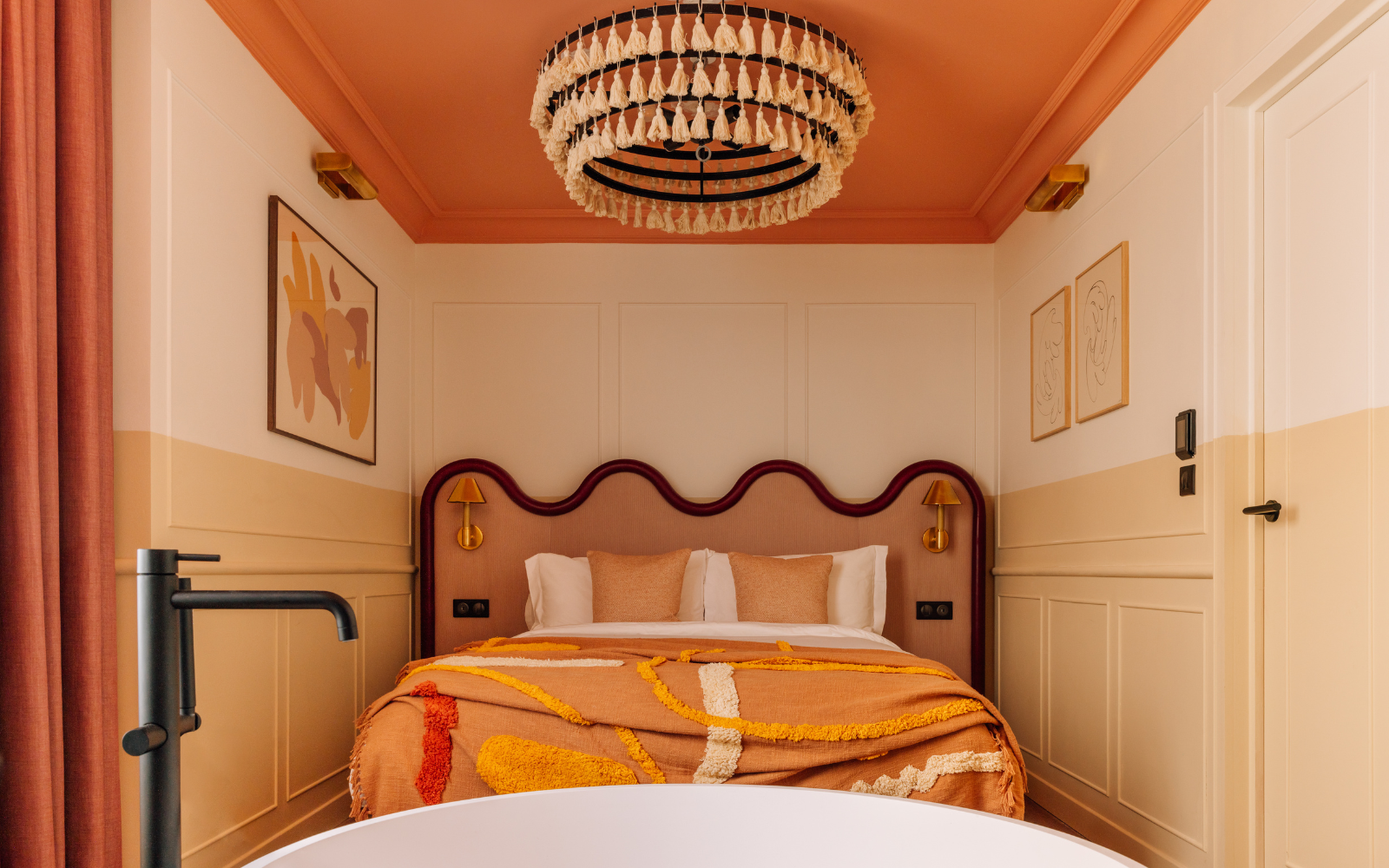 Luxury hotel bedroom at Locke hotel Paris with tufted chandelier by Northern Lights