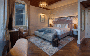Luxury hotel bedroom at the Caledonian Edinburgh with tufted chandelier by Northern Lights