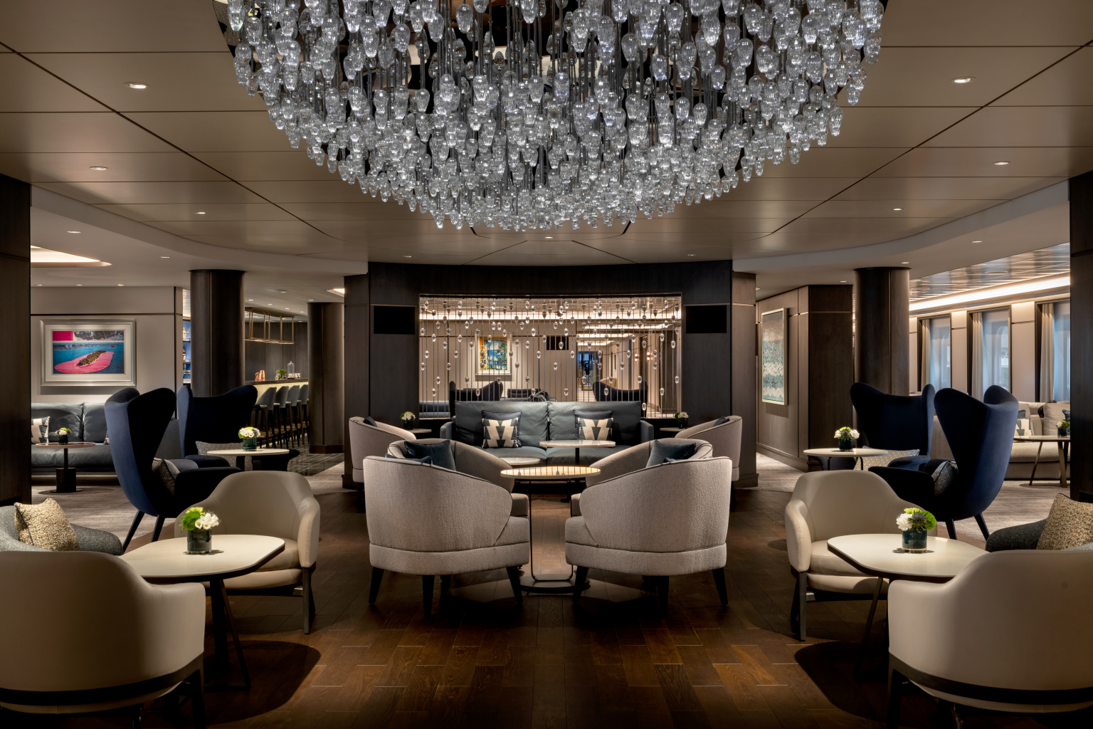 Living room with vast glass chandelier on Luminara Yacht