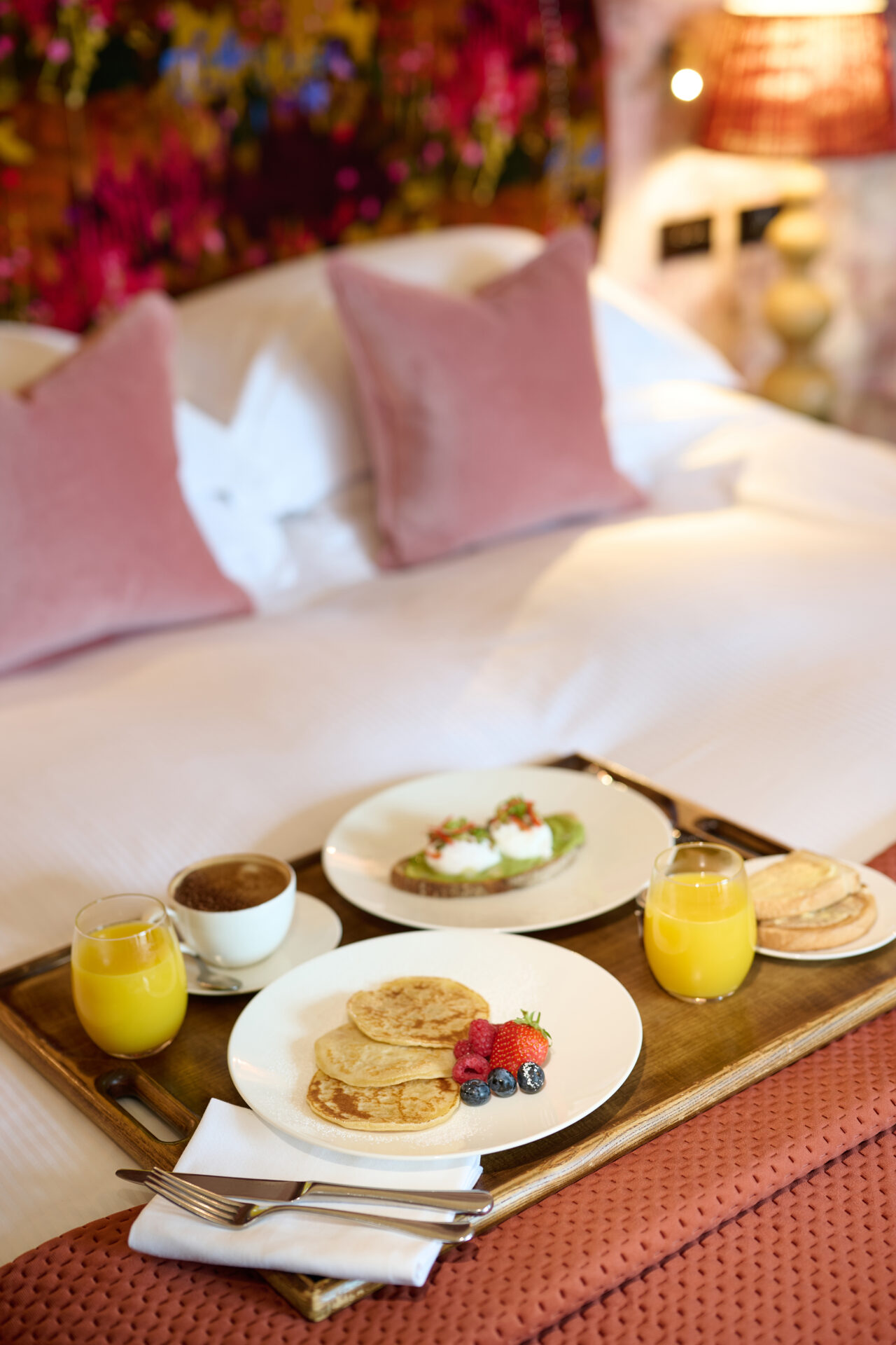 Breakfast on a bed at Seaham Hall Millbank Suite in velvet pink shades