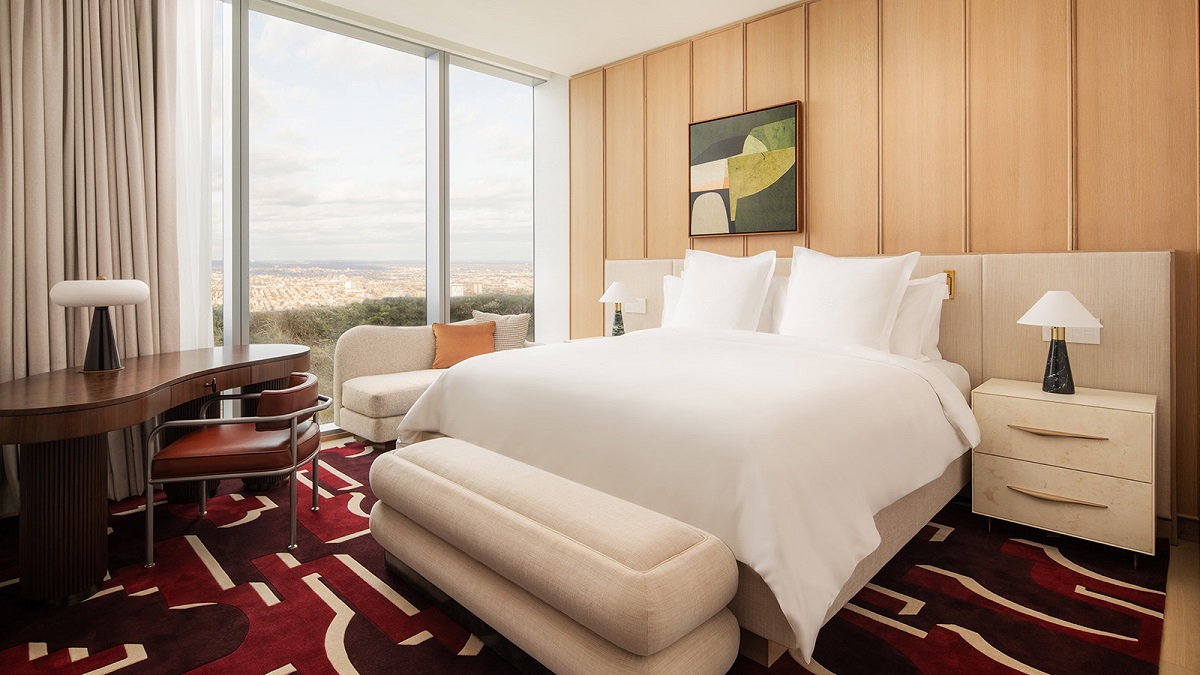 bold bespoke rug on the floor of penthouse bedroom