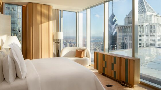 view from bed onto Philadelphia city skyline in design by 1508 for The Sky Garden, Four Seasons Philadelphia