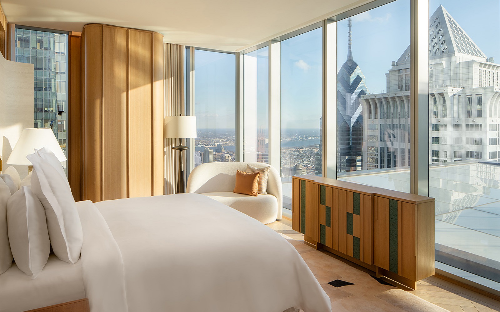 view from bed onto Philadelphia city skyline in design by 1508 for The Sky Garden, Four Seasons Philadelphia