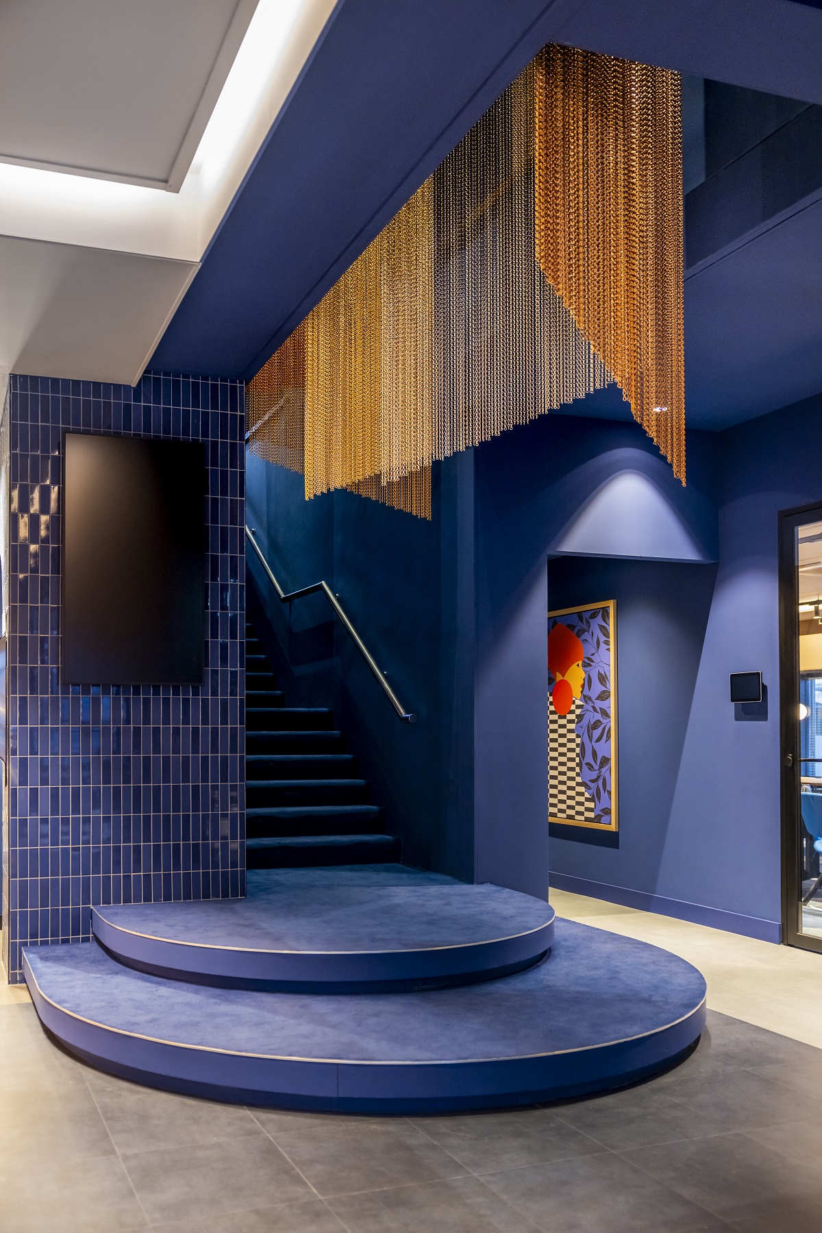 blue passage and stairwell in TRIBE Den Haag