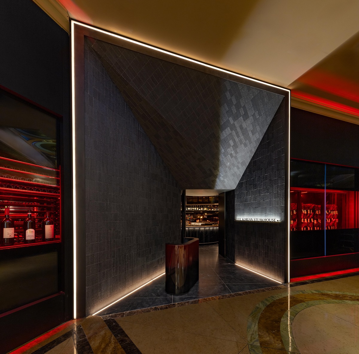 dark angled entrance to COTE restaurant