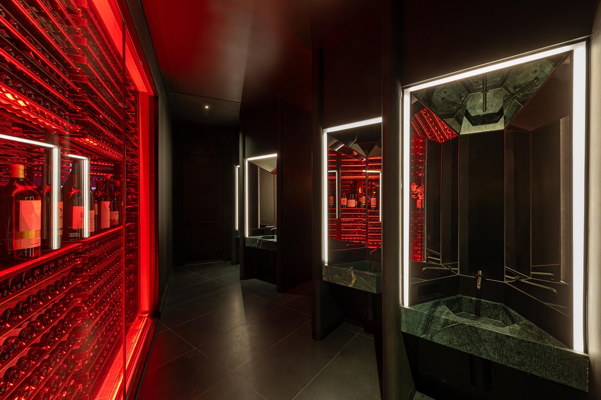 dark corridor with red lighting in COTE Vegas