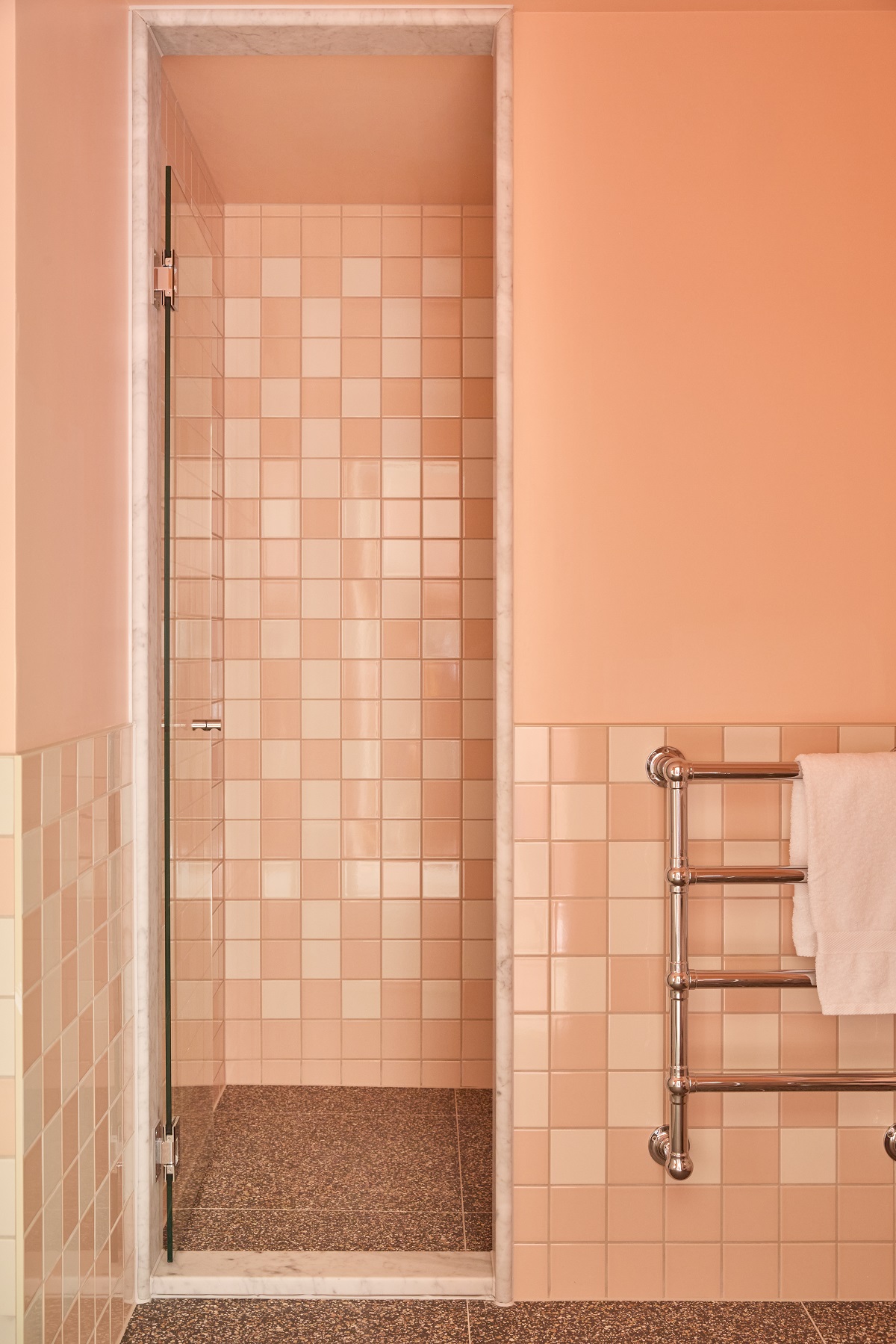 pink bathroom with towel radiator and walk-in shower enclosure
