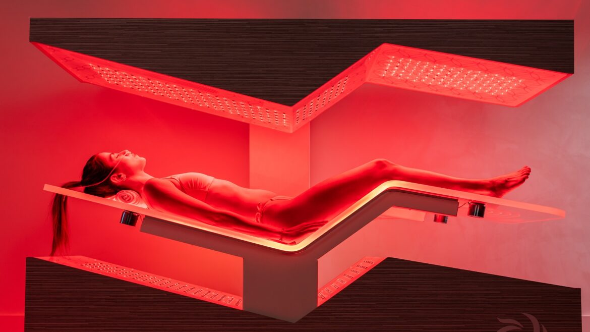 wellness trends - woman lying on Ammortal infra red bed