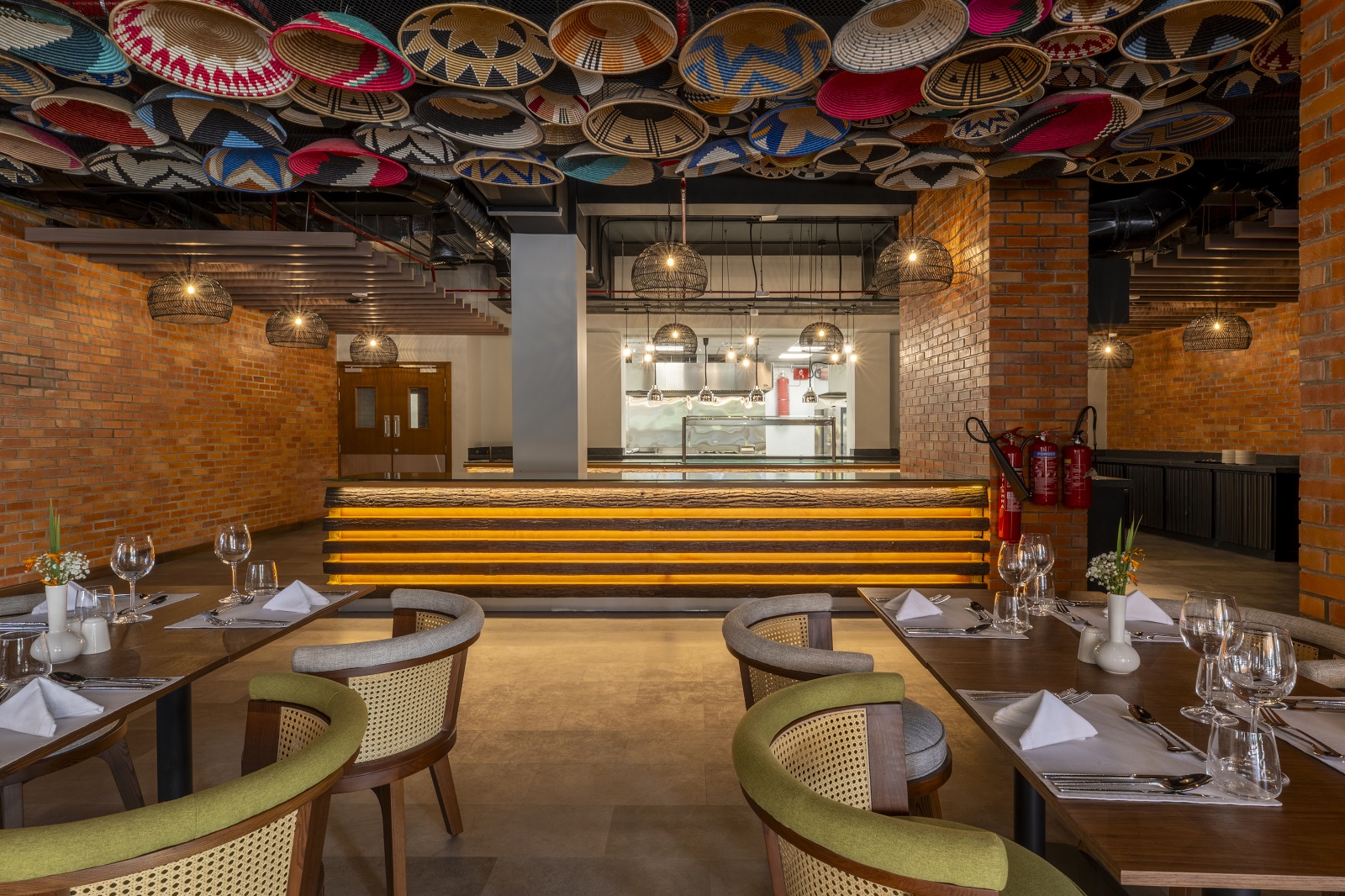 restaurant with african baskets on the ceiling Zaria-Court-Kigali-Tapestry-Collection-by-Hilton-Manselas-