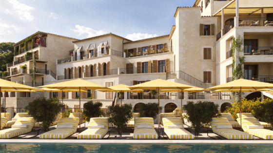 Hotel MArgalida on Mallorca view from pool with yellow umbrellas looking across to hotel