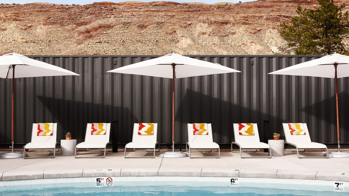sunloungers and umbrella by pool in Moab - Slackline Moab, Outset Collection - Hilton