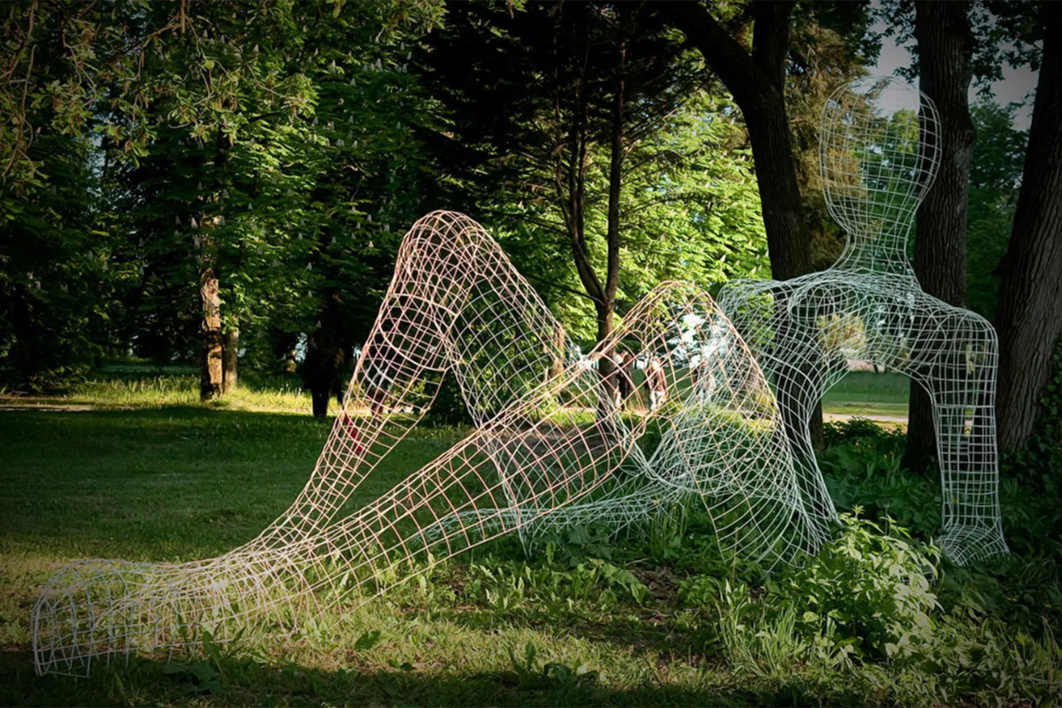 Lounging woman artwork made of white mesh
