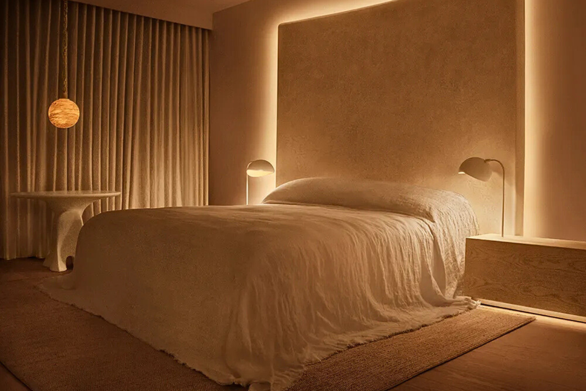 Cream bed with backlit headboard