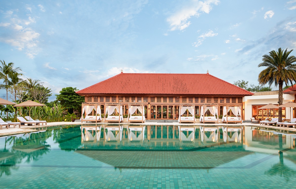 view across swimming pool to Paradisus Bali facade