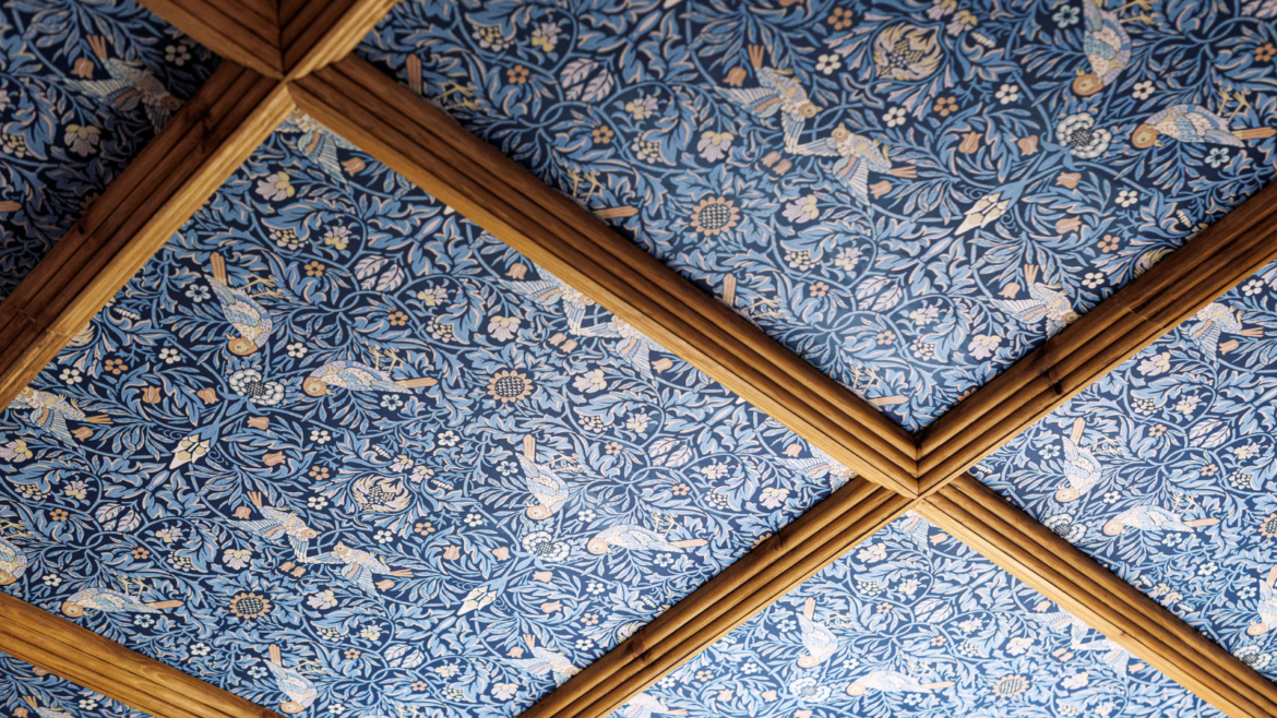 Morris & Co Strawberry thief wallpaper in blue