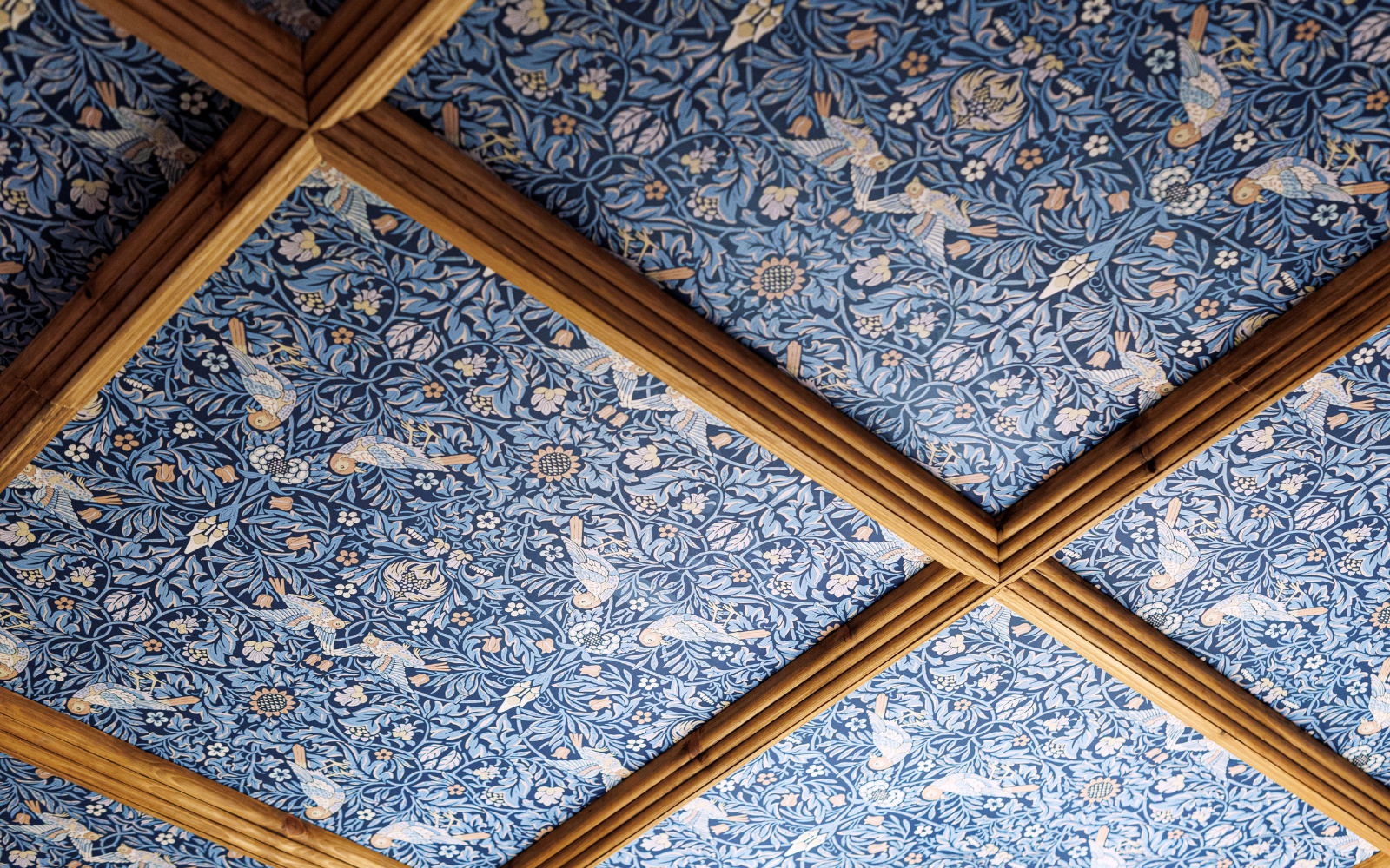 Morris & Co Strawberry thief wallpaper in blue