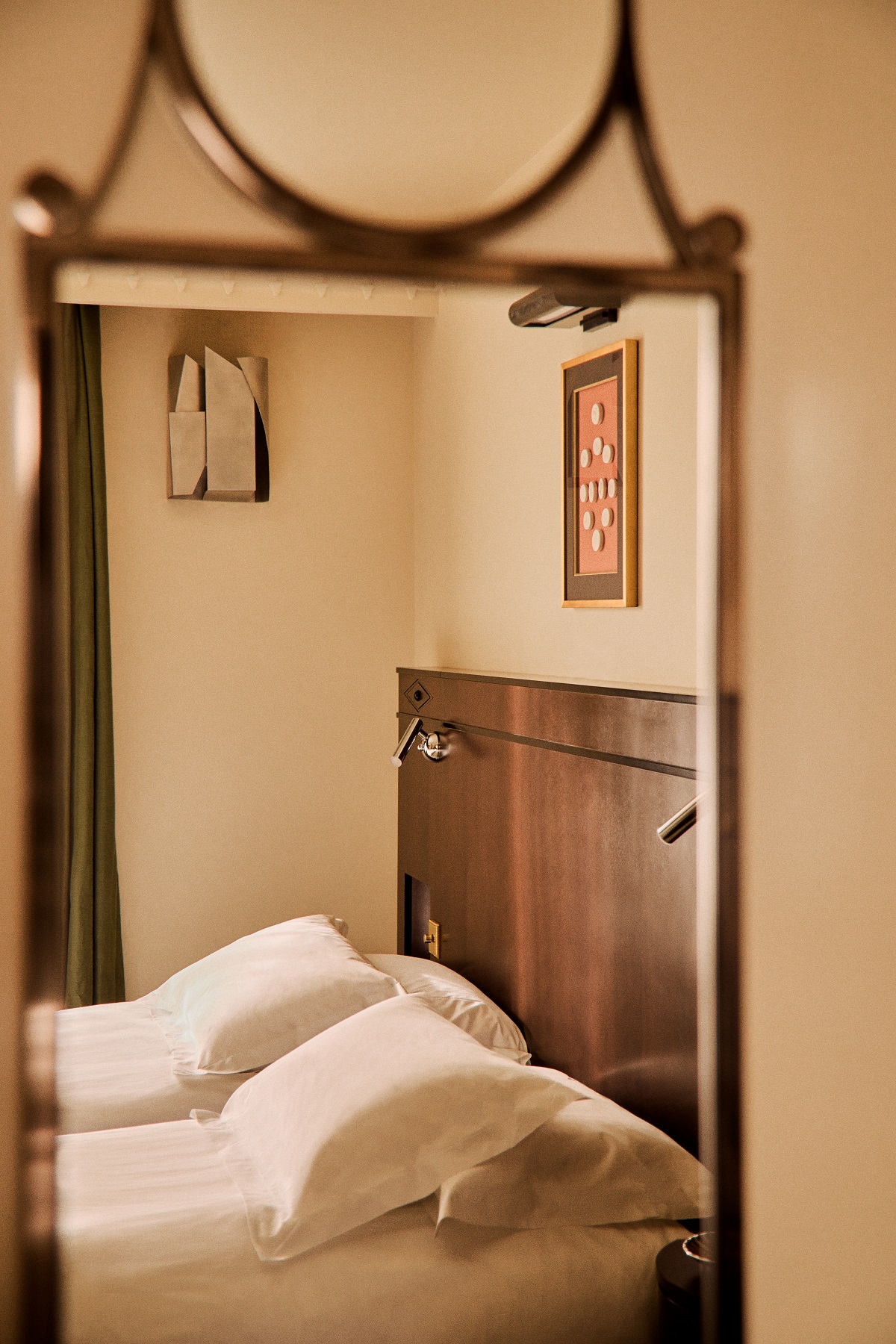 view of Grand hotel Bellevue guestroom reflected in mirror detail