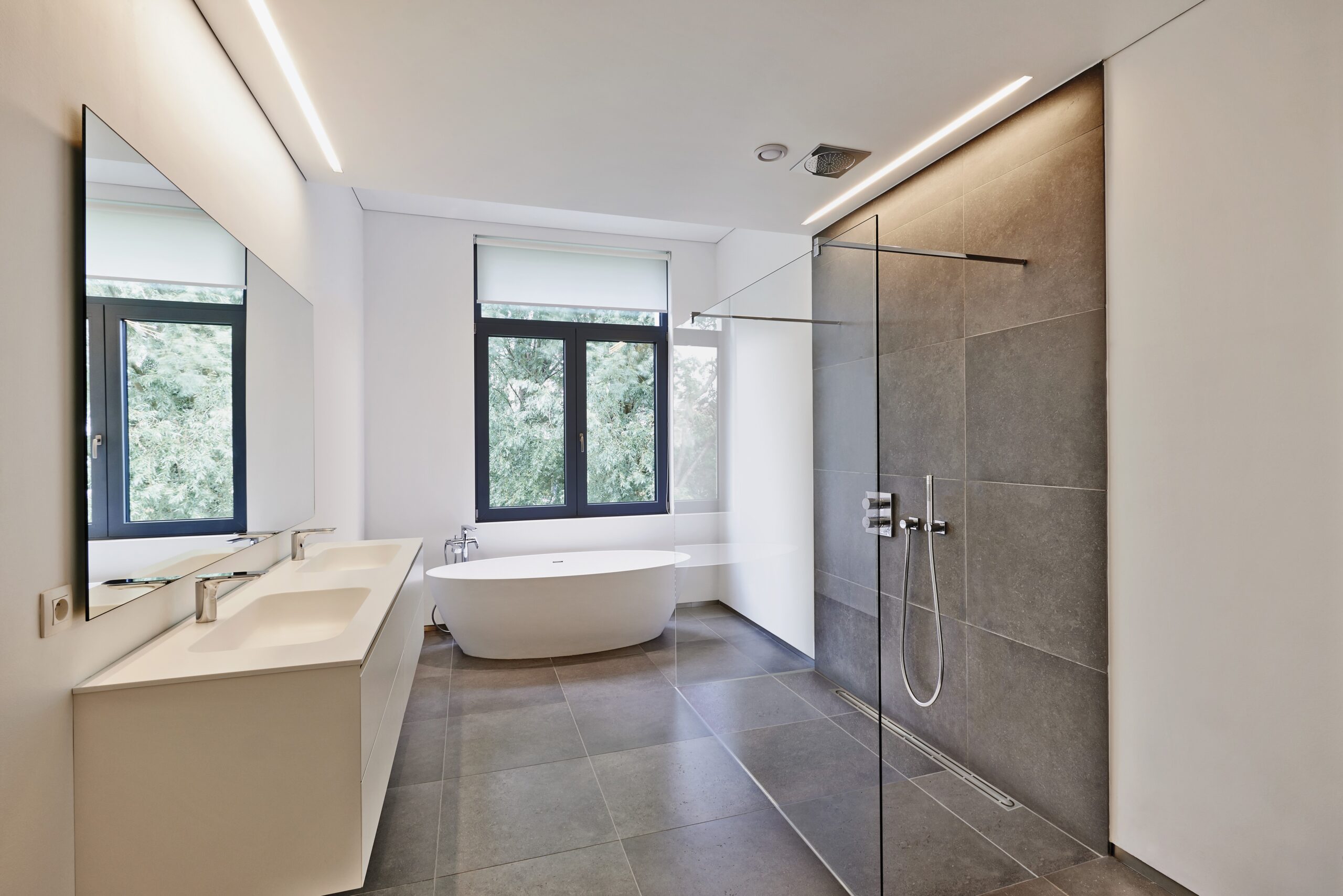 Pale hospitality bathroom with Schluter products