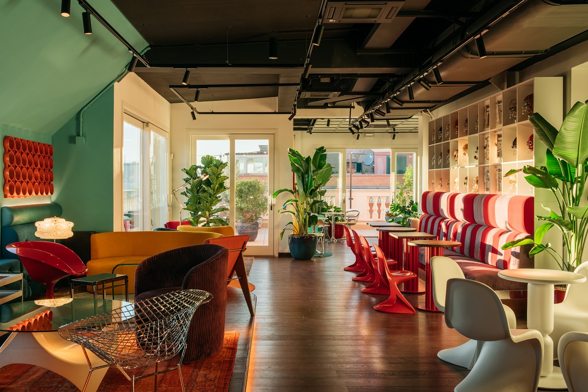 red chairs and green walls in Ruby Giulia rome