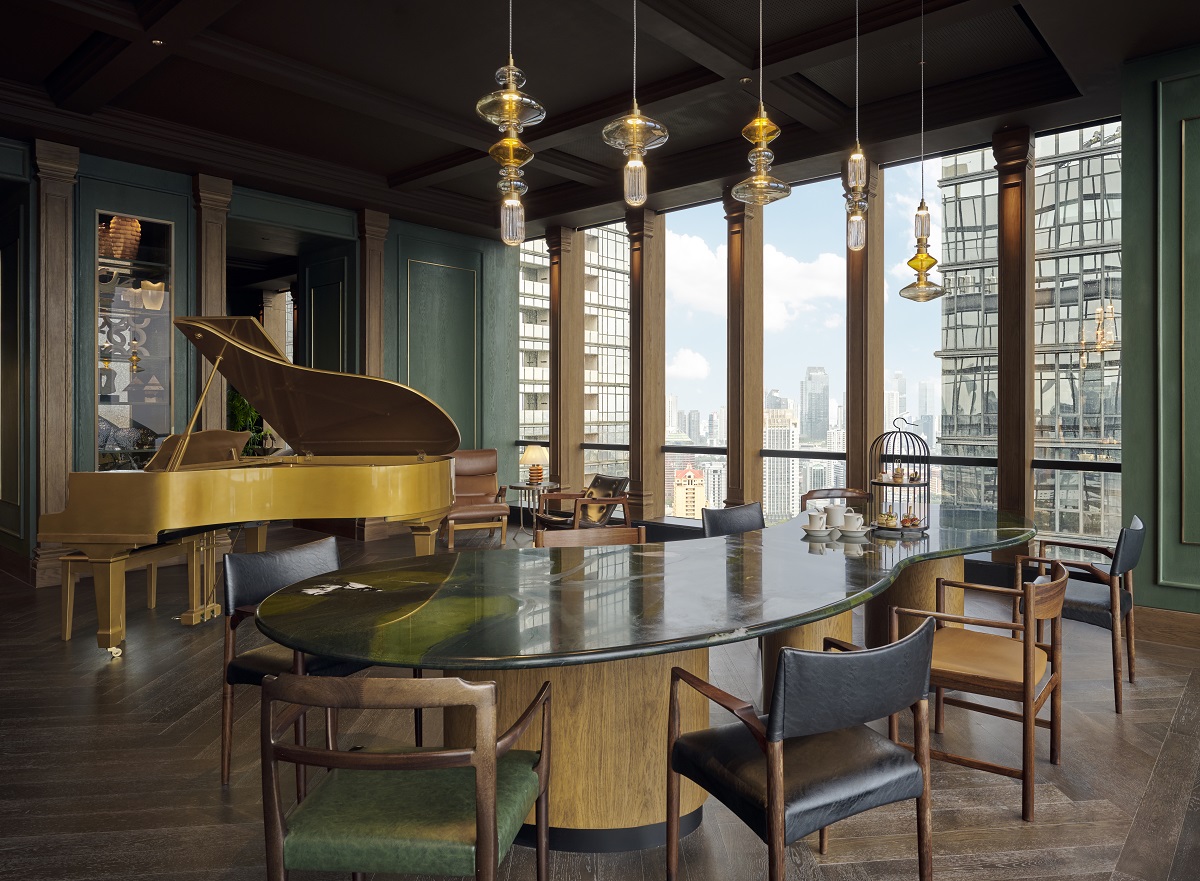 grand piano and dining room table in penthouse suite in 25hours The Oddbird