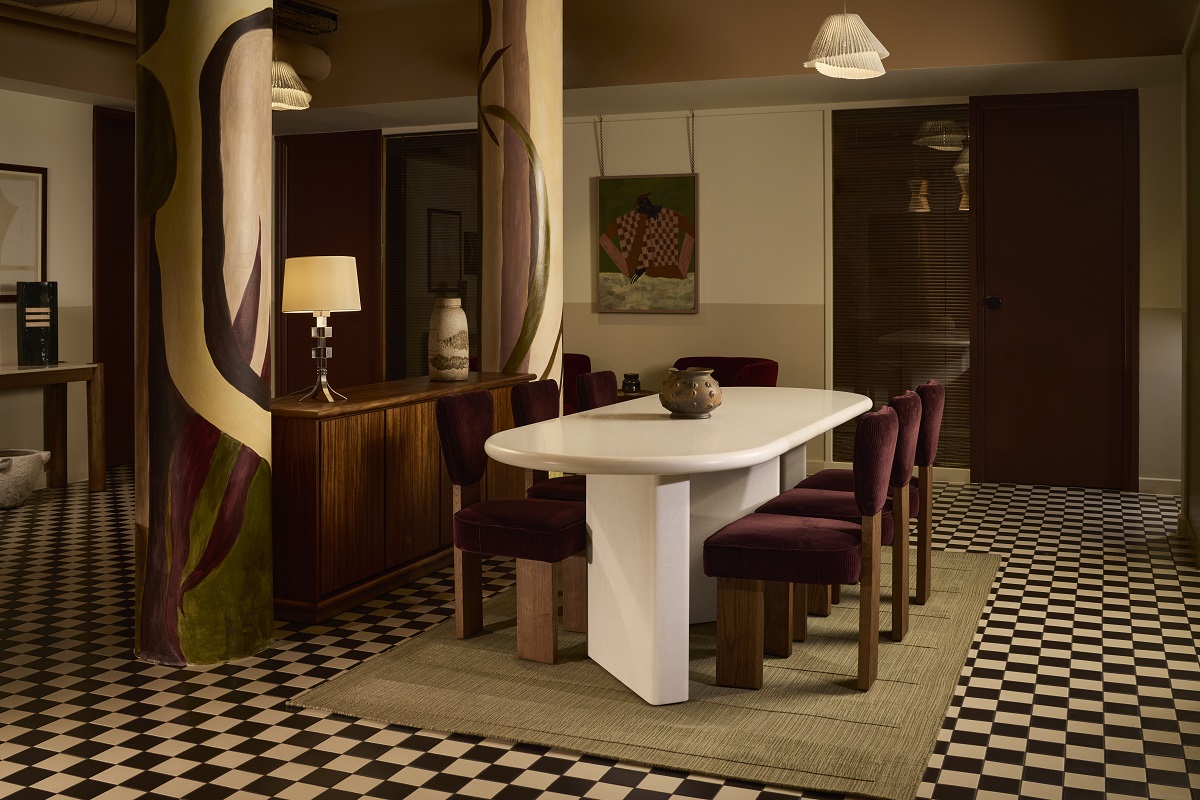 dining table and wooden chairs on checked floor in The Pantry The Hoxton shoreditch 