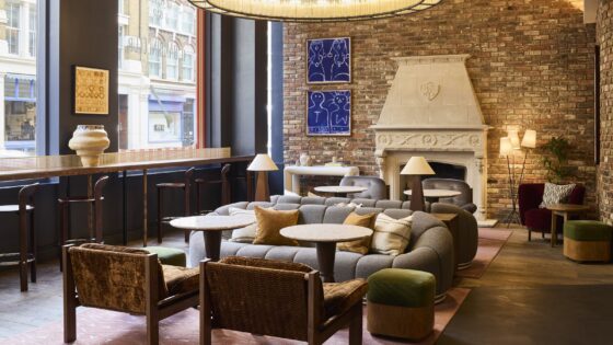 seating by fireplace in The Hoxton Shoreditch lobby