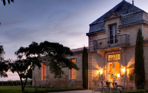 entrance to COMO Cordeillan-Bages lit up at night