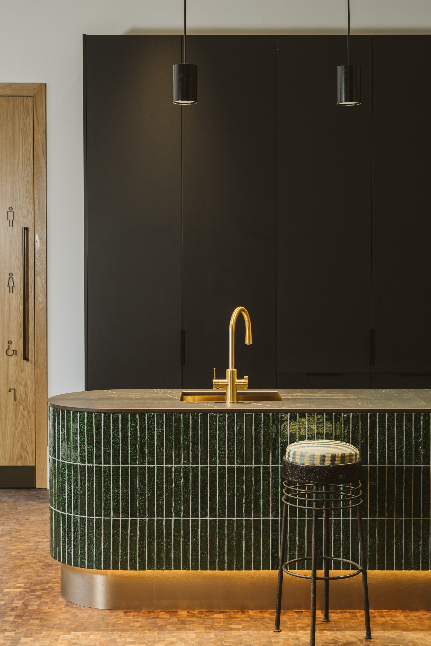 Dark green tiled kitchenette area in Sanderson Design Group