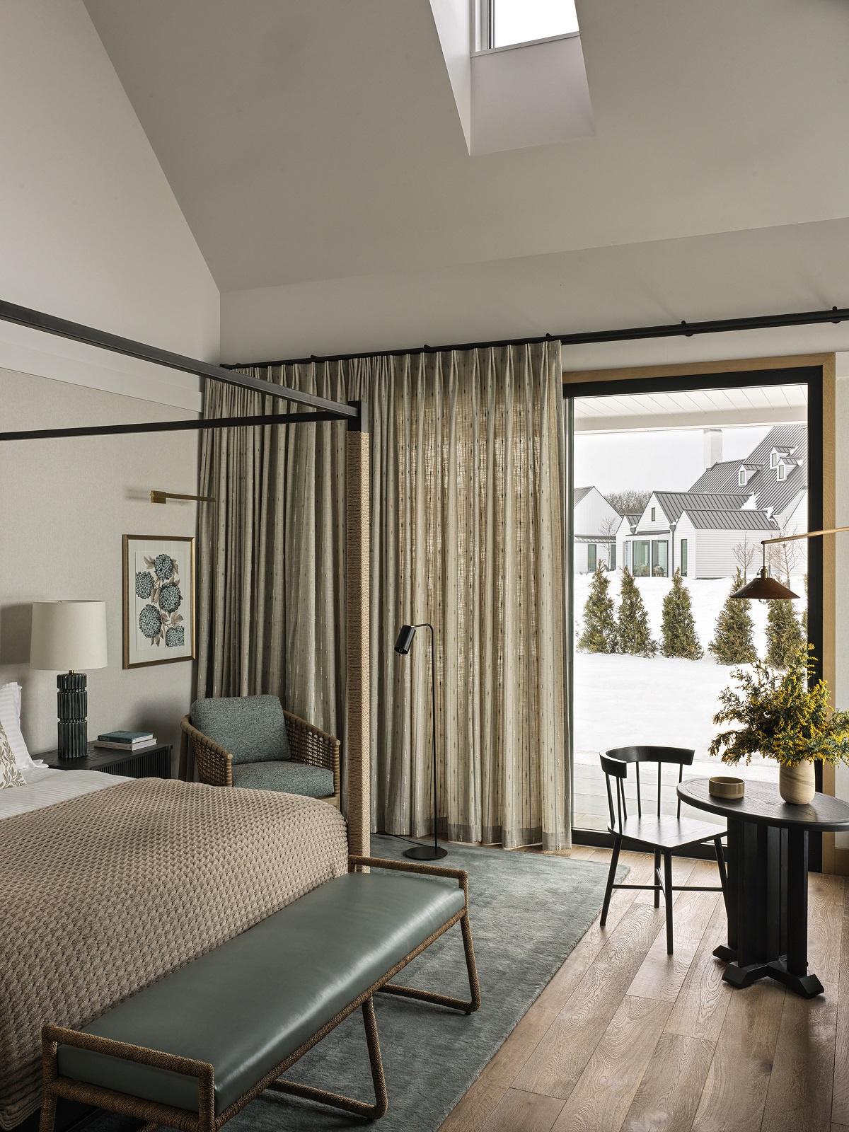 minimalist four poster bed in guestroom at Inns of Aurora design by Hart Howerton