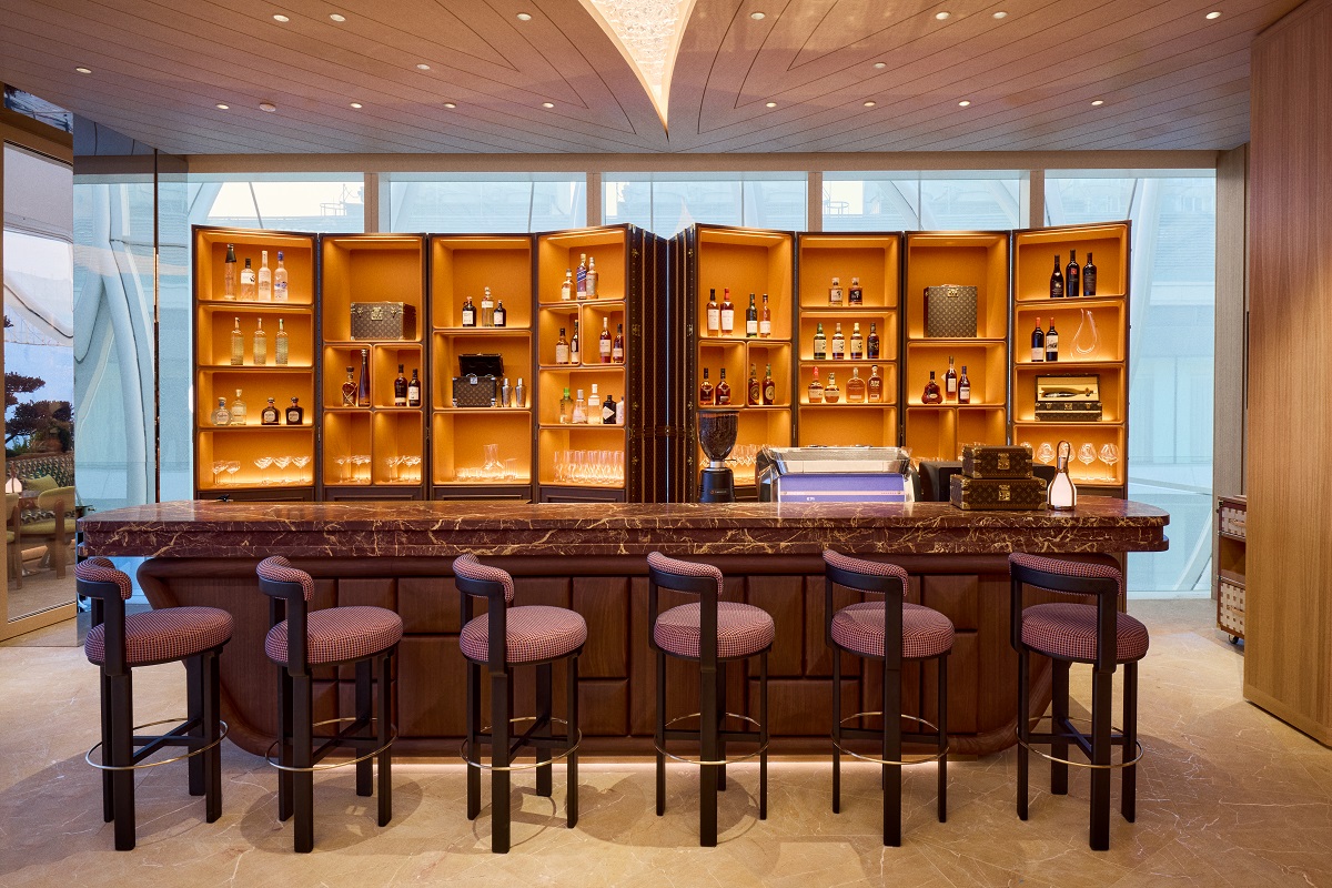 bar style seating in front of counter and display in Louis Vuitton Le Café in Beijing.