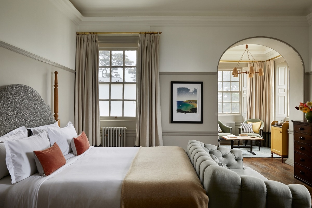 guestroom with seating alcove in Fowey Hall Hotel designed by Studio Jill