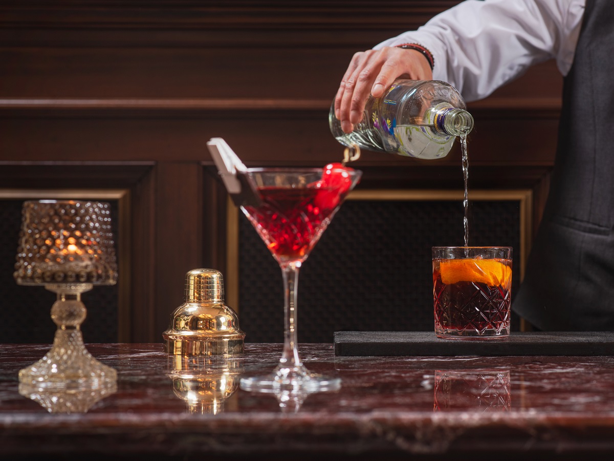 pouring cocktails on a marble table surface