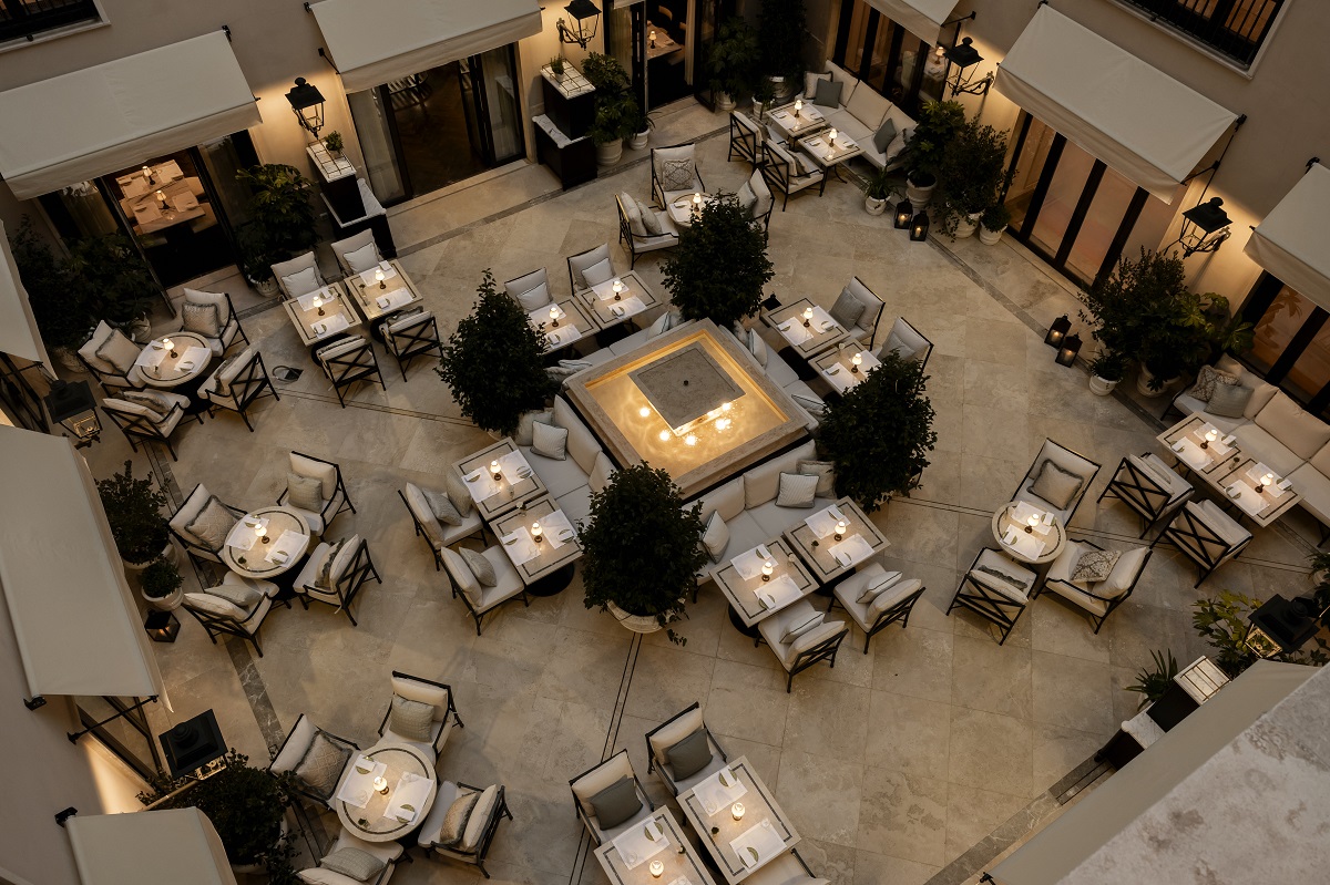 view from above, central courtyard in hotel with tables and chairsCorinthia_Rome_ Piazzetta