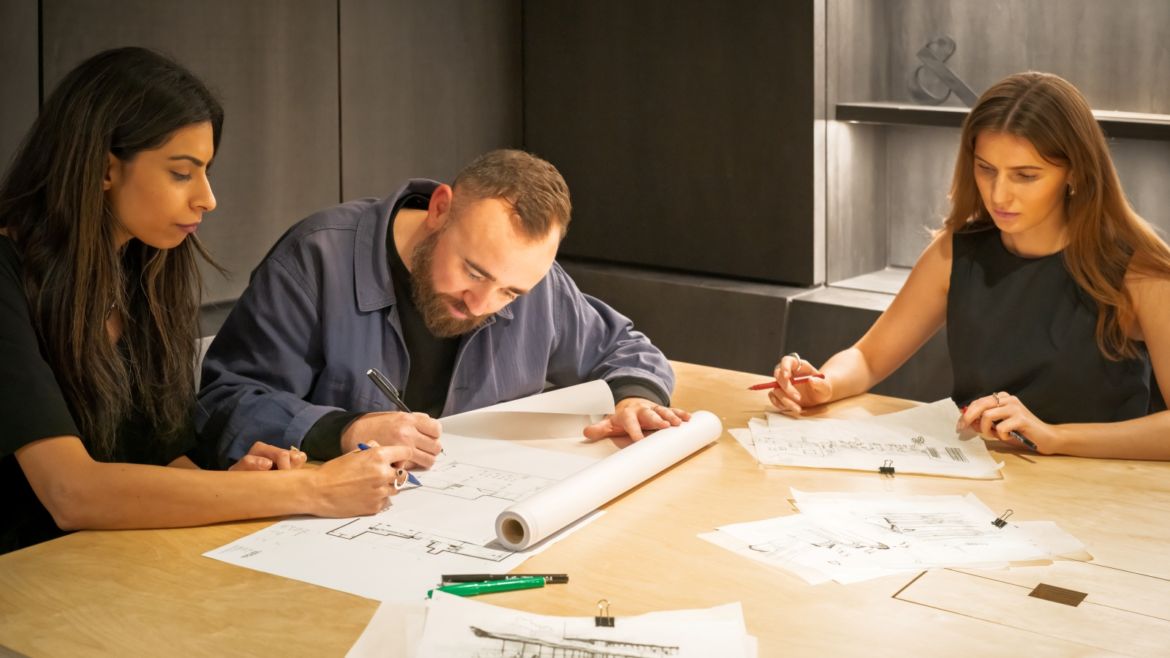 3 Conran & Partners designers working on sketches of the new ABI Interiors Clerkenwell showroom