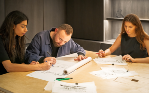 3 Conran & Partners designers working on sketches of the new ABI Interiors Clerkenwell showroom