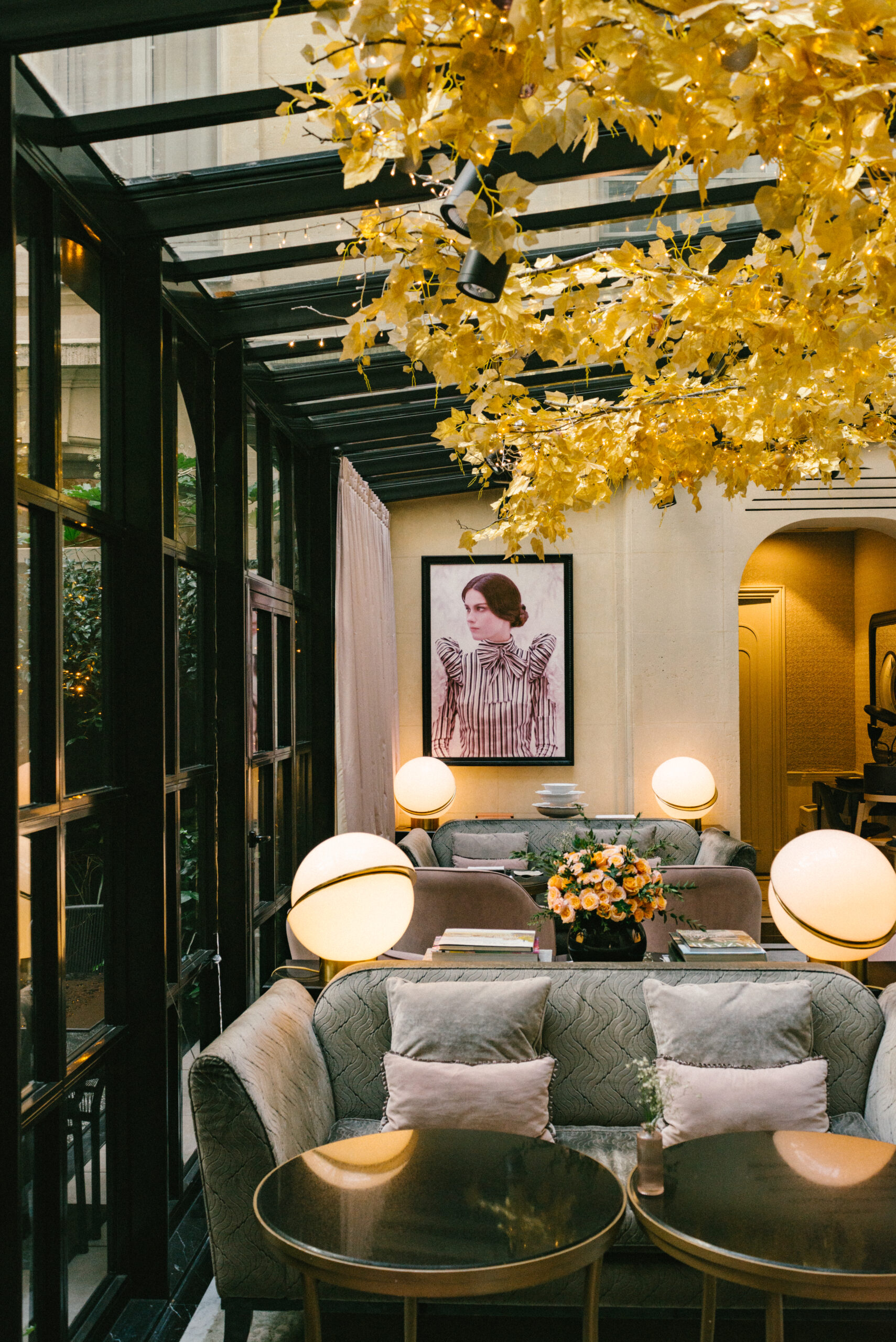 Le Narcisse Blanc lounge with gold leaf detailing on ceiling