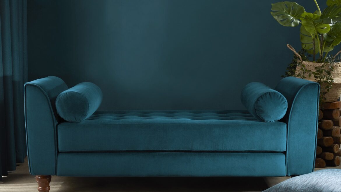 Blue wall and blue couch upholstered in Edmund Bell recycled velvet