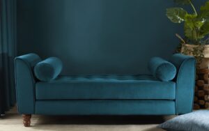 Blue wall and blue couch upholstered in Edmund Bell recycled velvet
